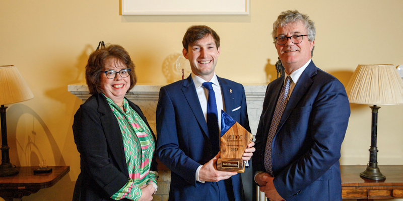 Paul O’Donovan, Quercus Sports Scholar, UCC Rower and Olympic gold-medal winner is presented with the UCC Graduate of the Year 2023 Award by Professor Paula O'Leary, Dean, School of Medicine and Professor John O’Halloran, UCC President.