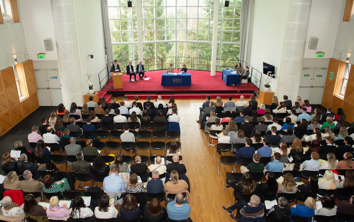 View from above of CBL Scholarships and Prizes Award Ceremony in Devere Hall, Áras na MacLéinn Student Centre.  Pictured on stage are Law and Irish student Amergin Quinlan, Head of College Professor Thia Hennessy, Interim Dean of CUBS Professor Anthony McDonnell, Dean of the School of Law Professor Mark Poustie, and Ber Madden and Thelma Kenny from the College Office